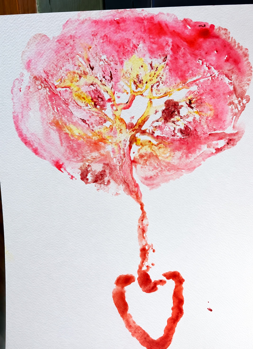 A placenta print in red on paper